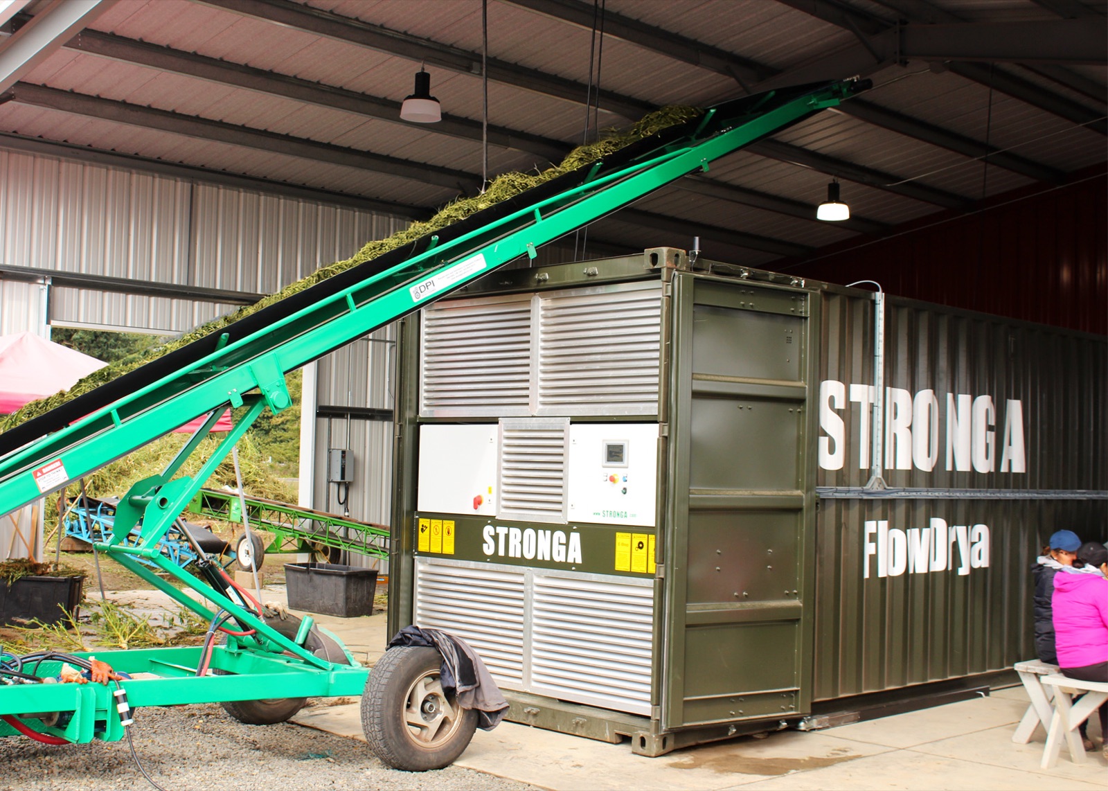 FlowDrya hemp dryer being loaded on-site